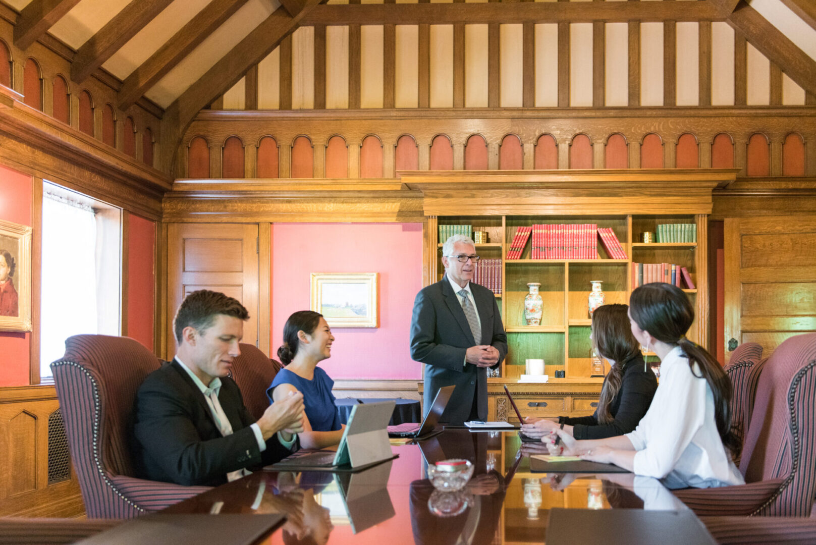 A group of people sitting around a table.