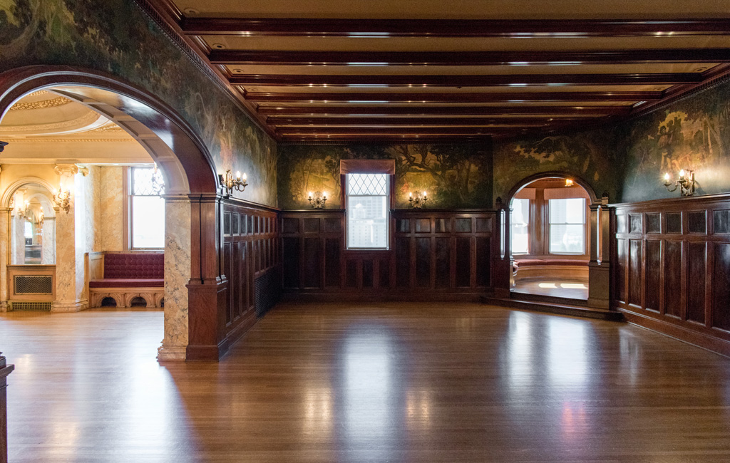 A large room with wood floors and walls.